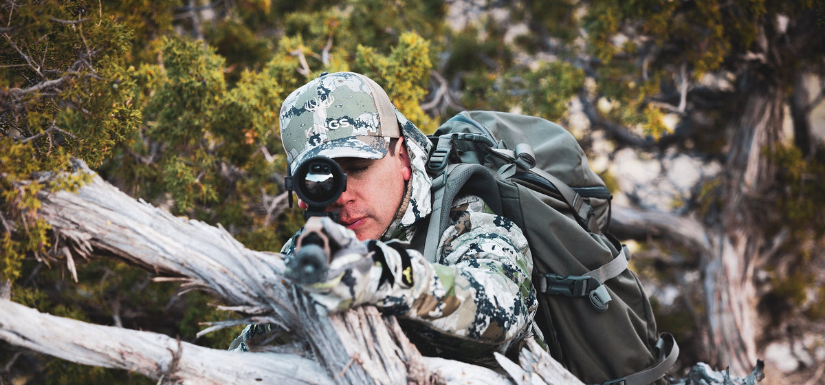 Hunter aiming an AGM Rattler V3 thermal riflescope