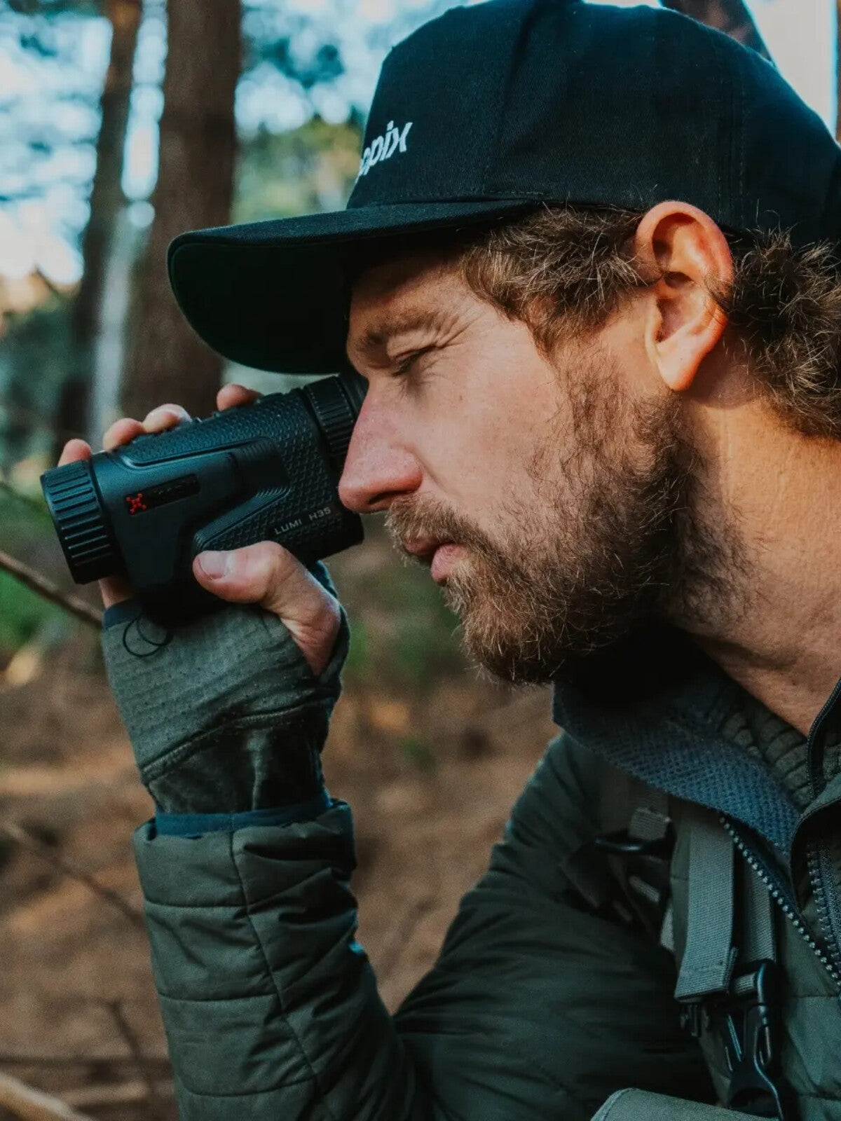 Nocpix Lumi thermal monocular in use by a hunter in the field