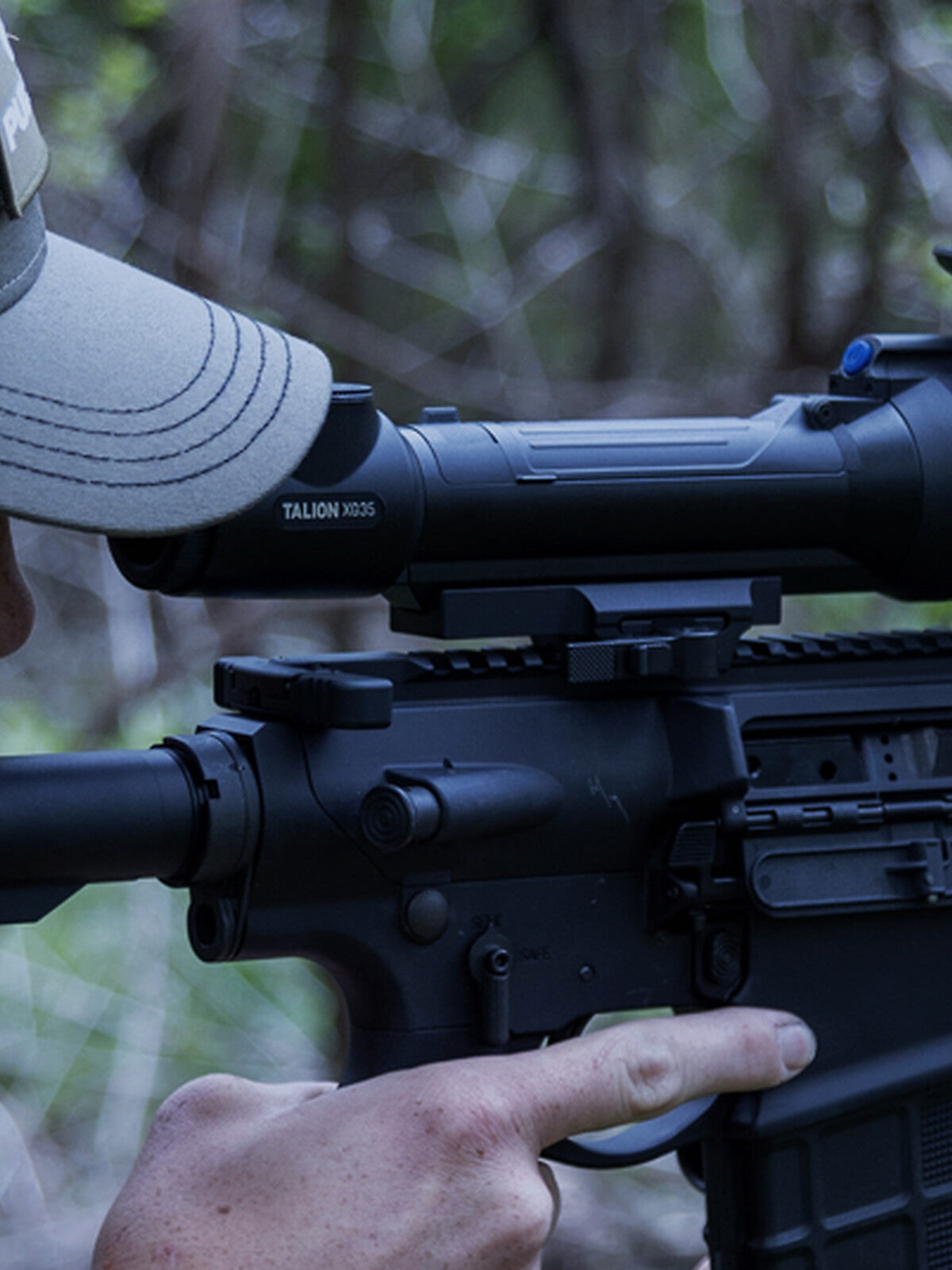 Pulsar Talion XQ35 Pro mounted on a rifle, hunter aiming in the field