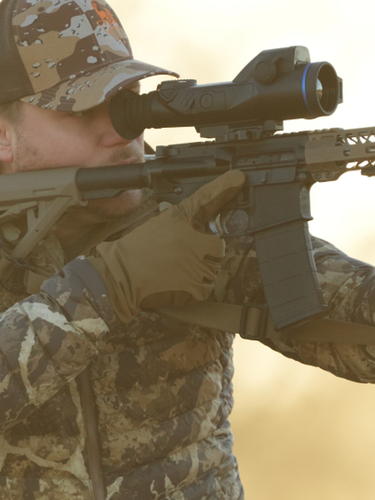 Pulsar Trail 3 LRF XQ50 mounted on a rifle, hunter aiming in the field