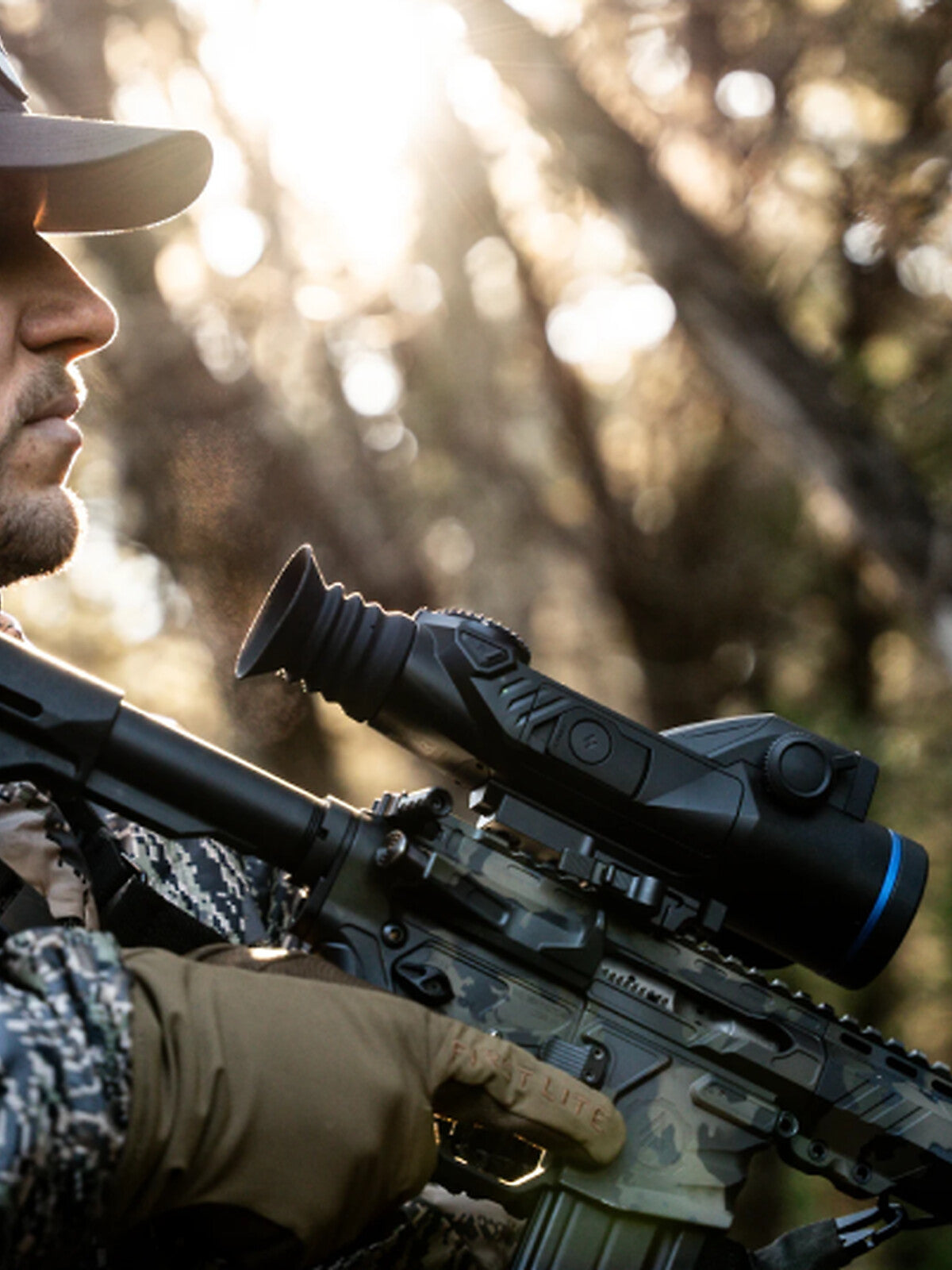 Pulsar Trail 3 LRF XR50 mounted on a rifle, hunter carrying it in the field
